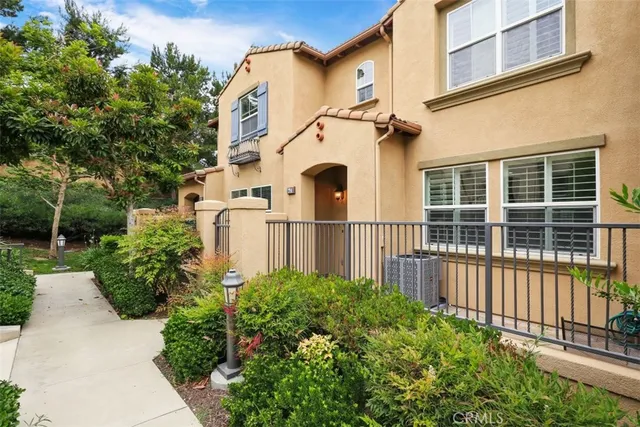 front view of a house with a garden