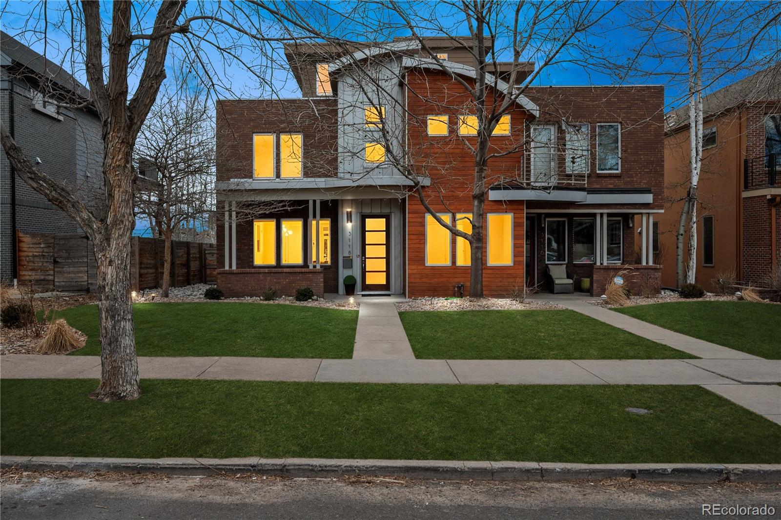 a view of a brick building with a yard