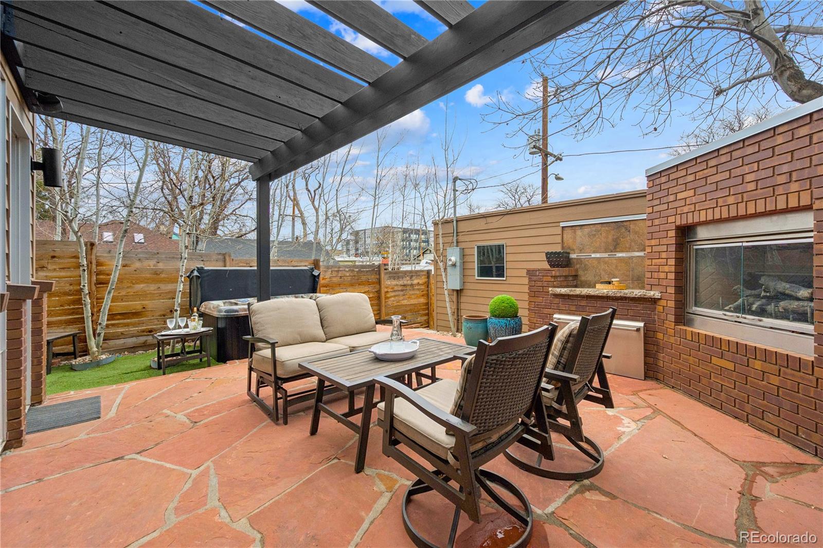 3118 Newton Street Denver, CO 80211 - Photo 22 of 29 a view of a patio with table and chairs and potted plants