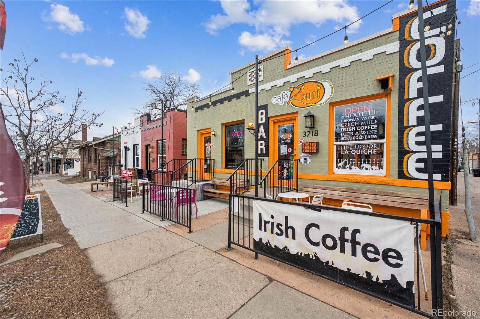 3118 Newton Street Denver, CO 80211 - Photo 26 of 29 a view of city street with retail shops
