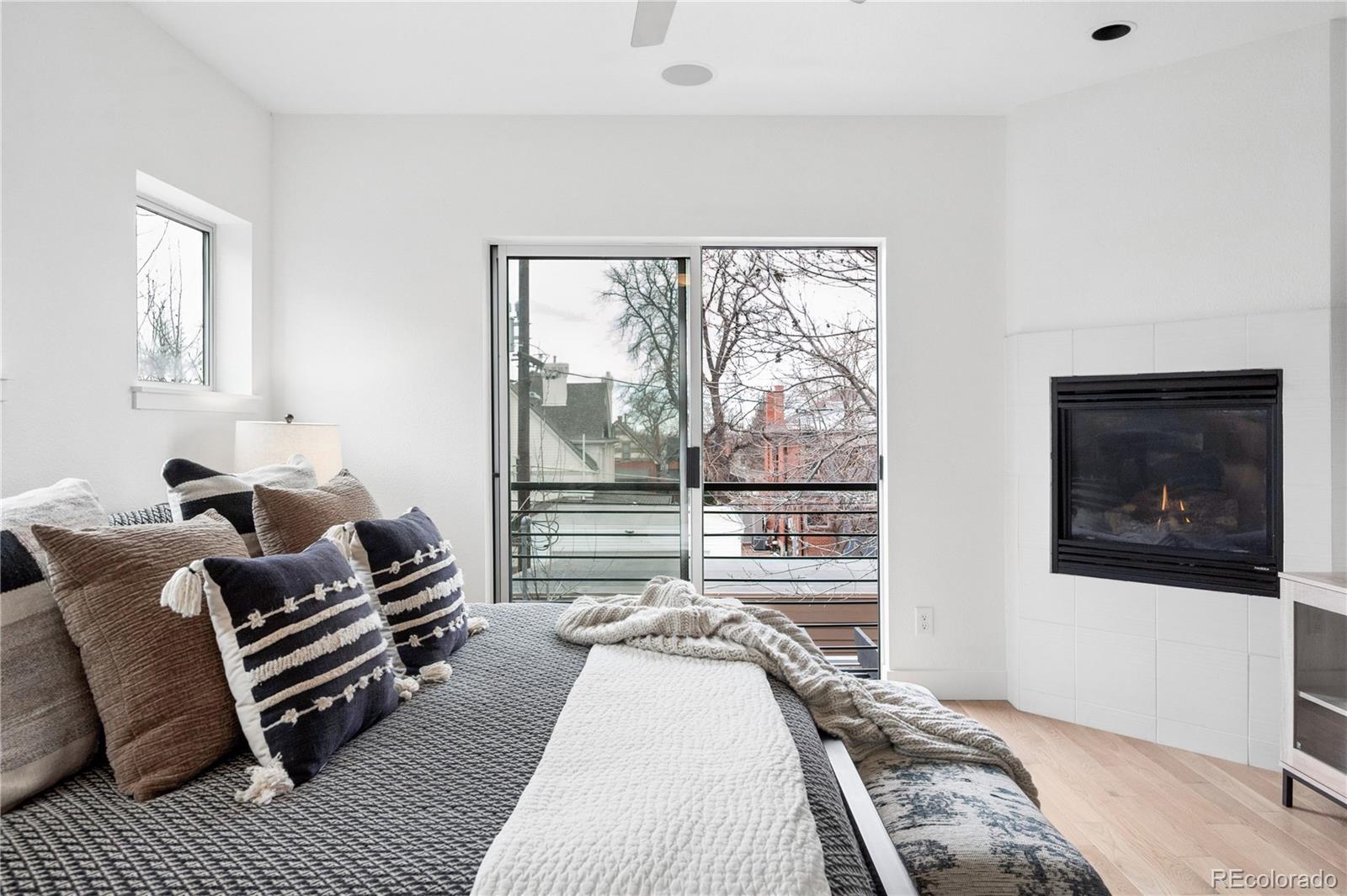 3118 Newton Street Denver, CO 80211 - Photo 10 of 29 a bedroom with furniture and a large window