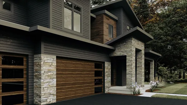 a front view of a house with a garage