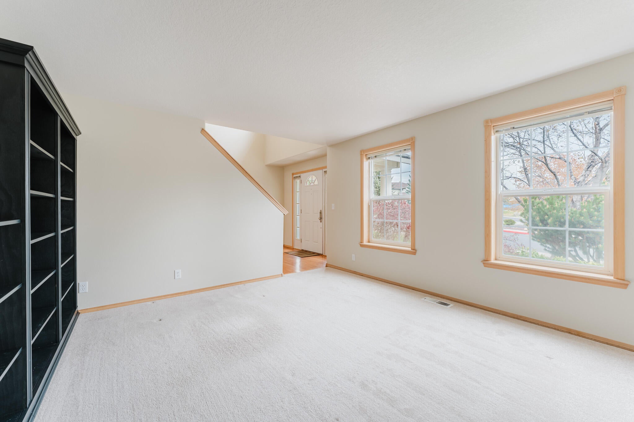 3626 Southwest Volcano Court Redmond, OR 97756 - Photo 23 of 89 This is an additional living space just inside the front door with built-in shelving. How would you use it? Library, large executive office, living room, music room, sewing or craft room?
