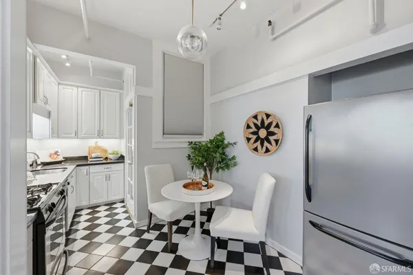 a kitchen with a table and chairs