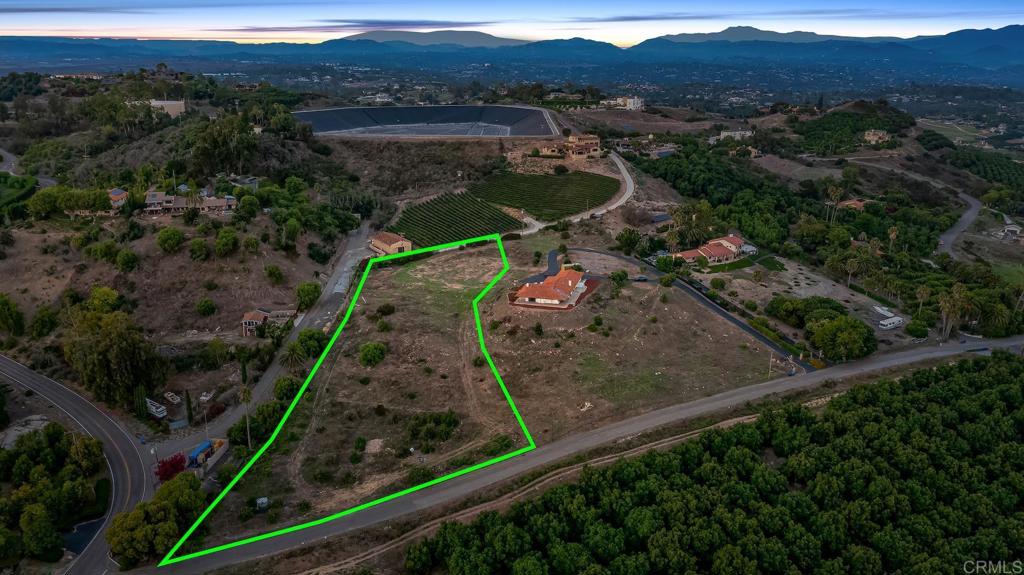 an aerial view of a house with a garden