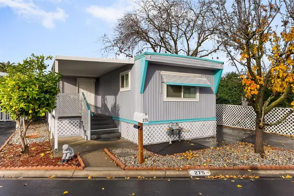 a front view of a house with stairs