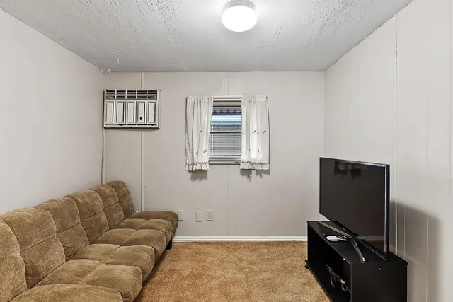 a bathroom with a sink a toilet and a shower