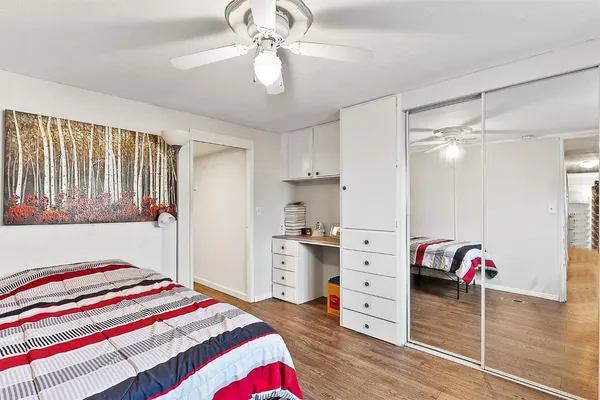 a bedroom with a bed and a dresser