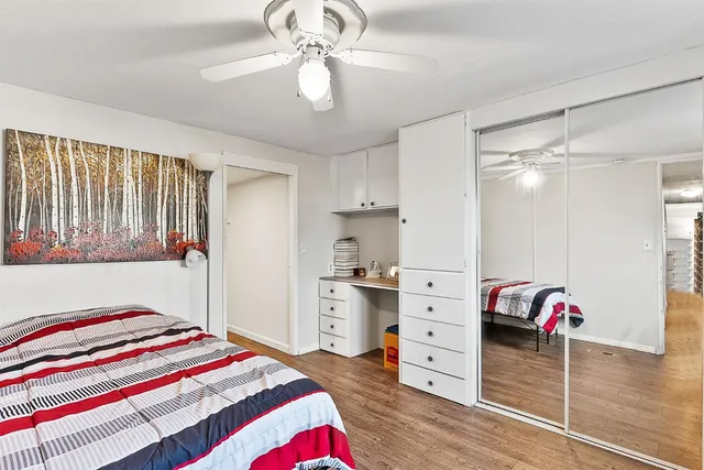 a bedroom with a bed and a dresser