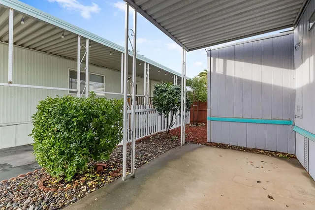 a view of an outdoor space with wooden fence