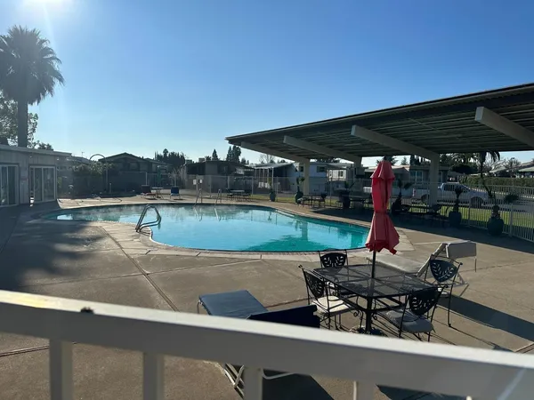 a view of an house with a backyard