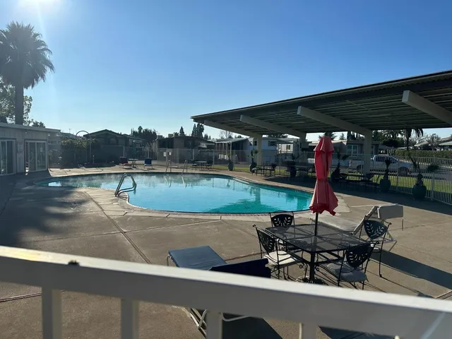 a view of an house with a backyard