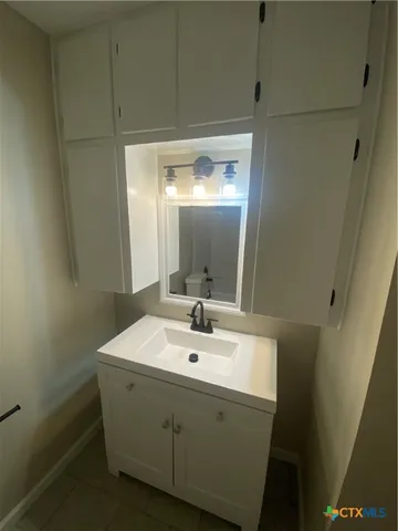 a bathroom with a sink and a mirror