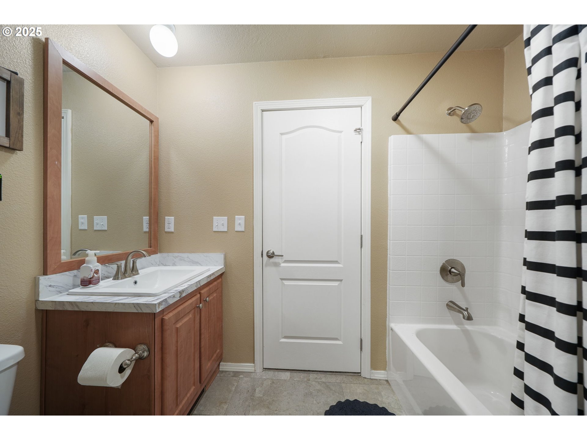 176 West Main Street Alsea, OR 97324 - Photo 11 of 16 a bathroom with a tub sink and mirror