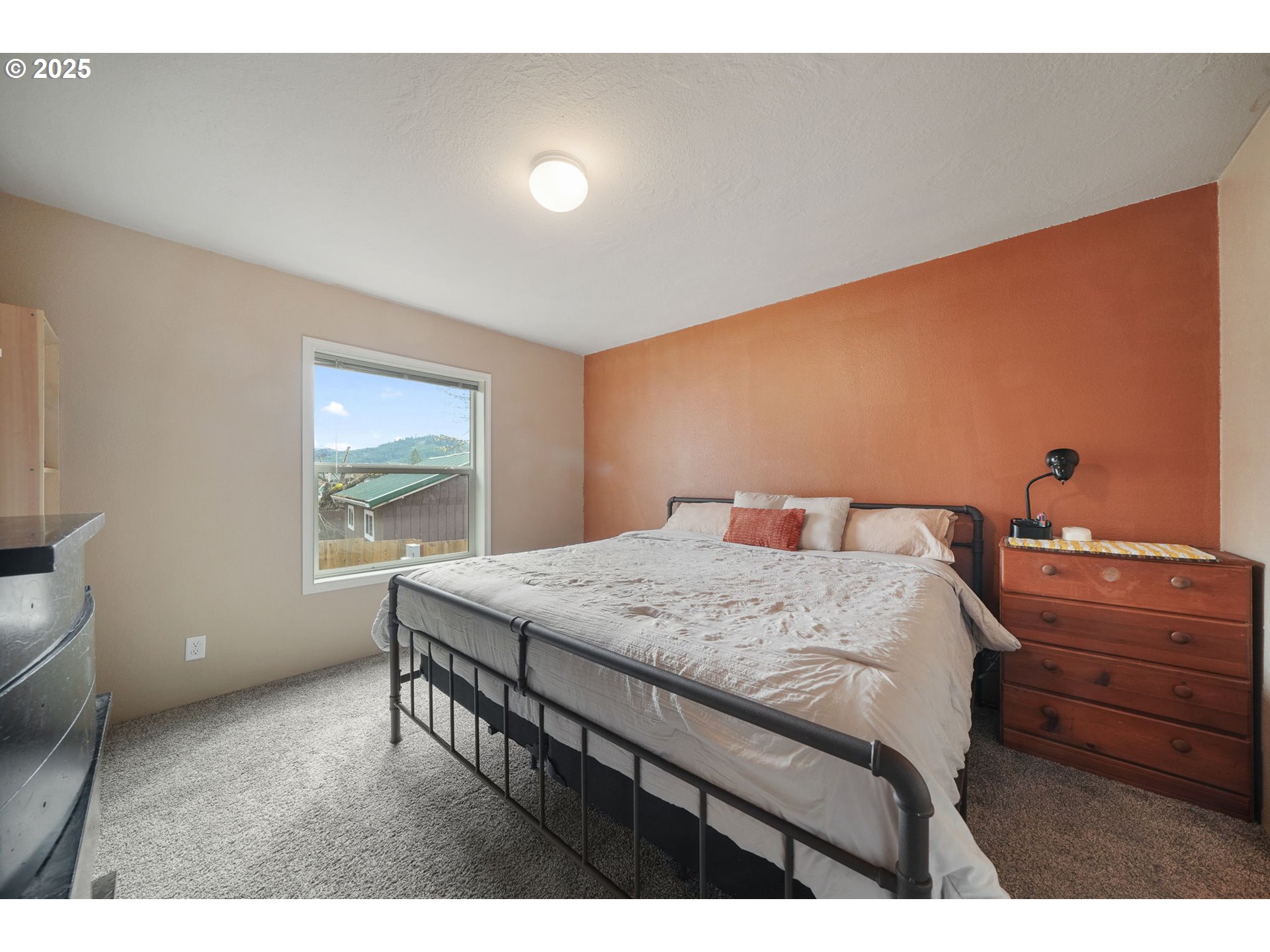 176 West Main Street Alsea, OR 97324 - Photo 12 of 16 a bedroom with a bed and a window