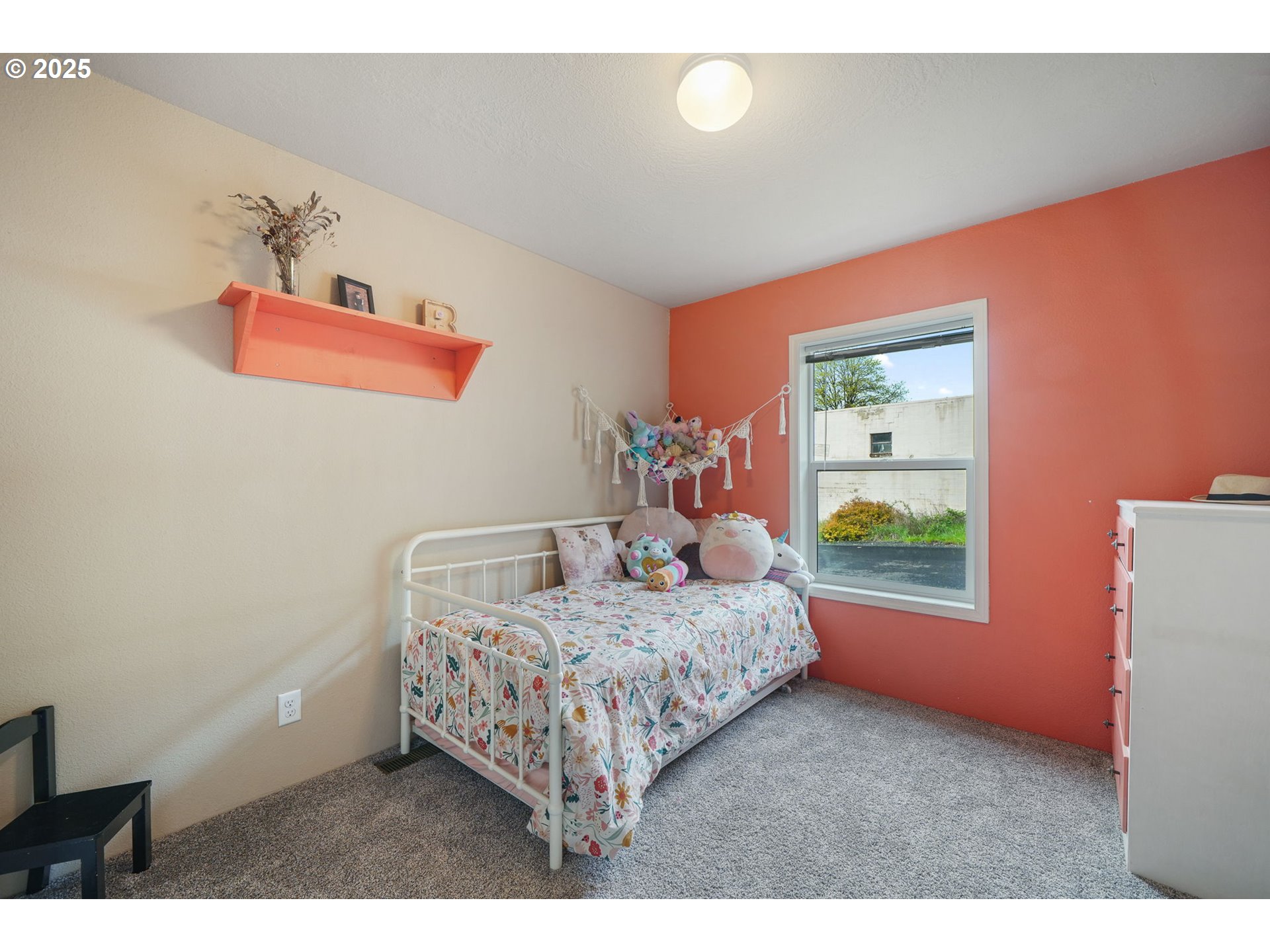 176 West Main Street Alsea, OR 97324 - Photo 15 of 16 a bedroom with a bed and a window