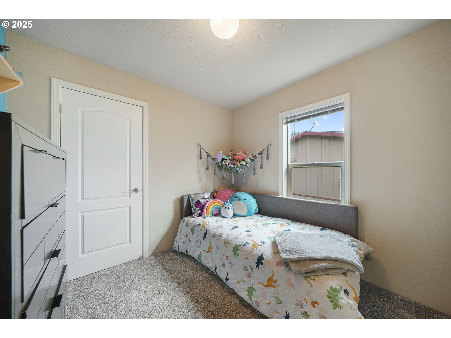 176 West Main Street Alsea, OR 97324 - Photo 16 of 16 a bedroom with a bed and a window