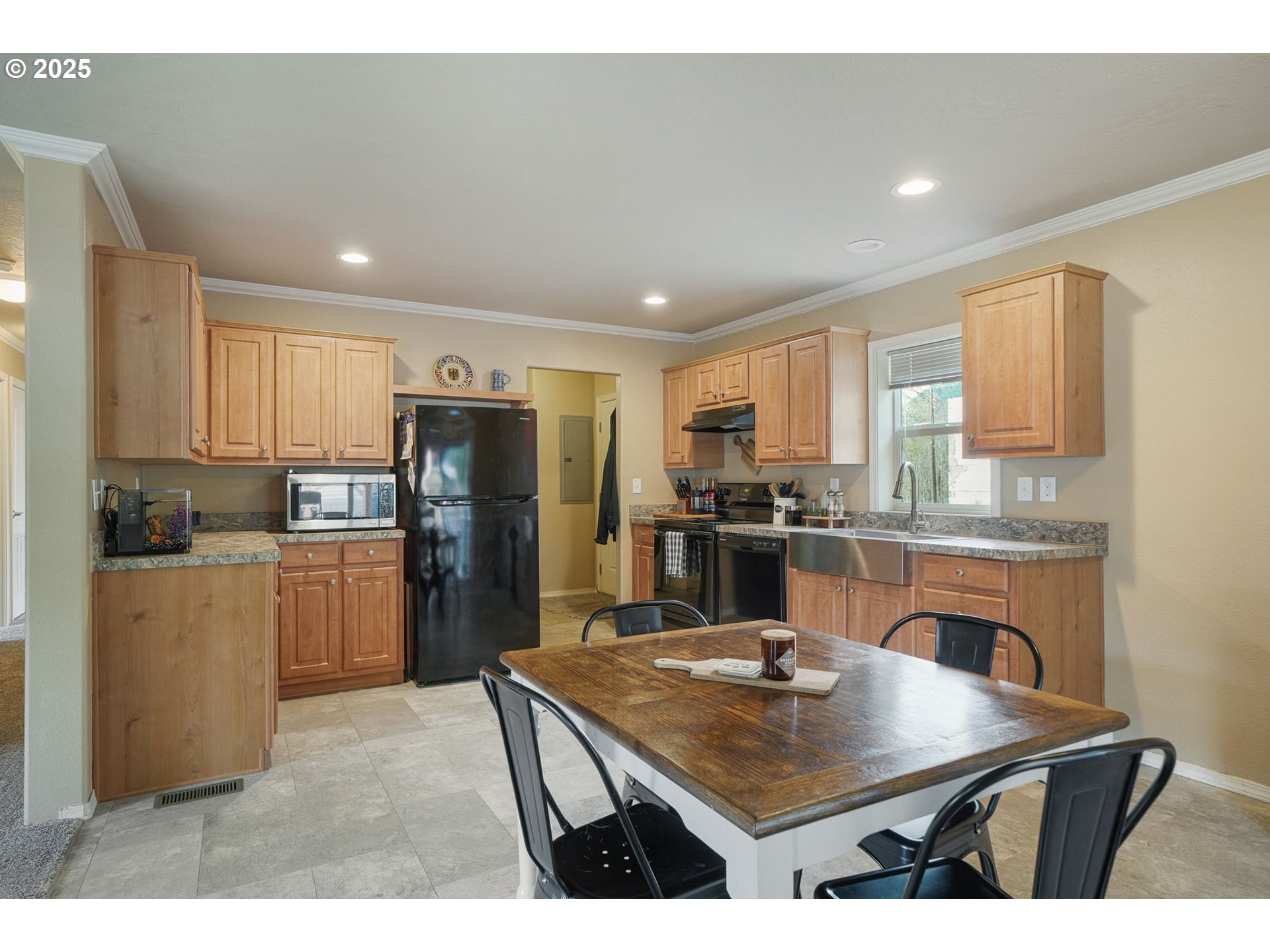 176 West Main Street Alsea, OR 97324 - Photo 5 of 16 a kitchen with refrigerator cabinets and wooden floor