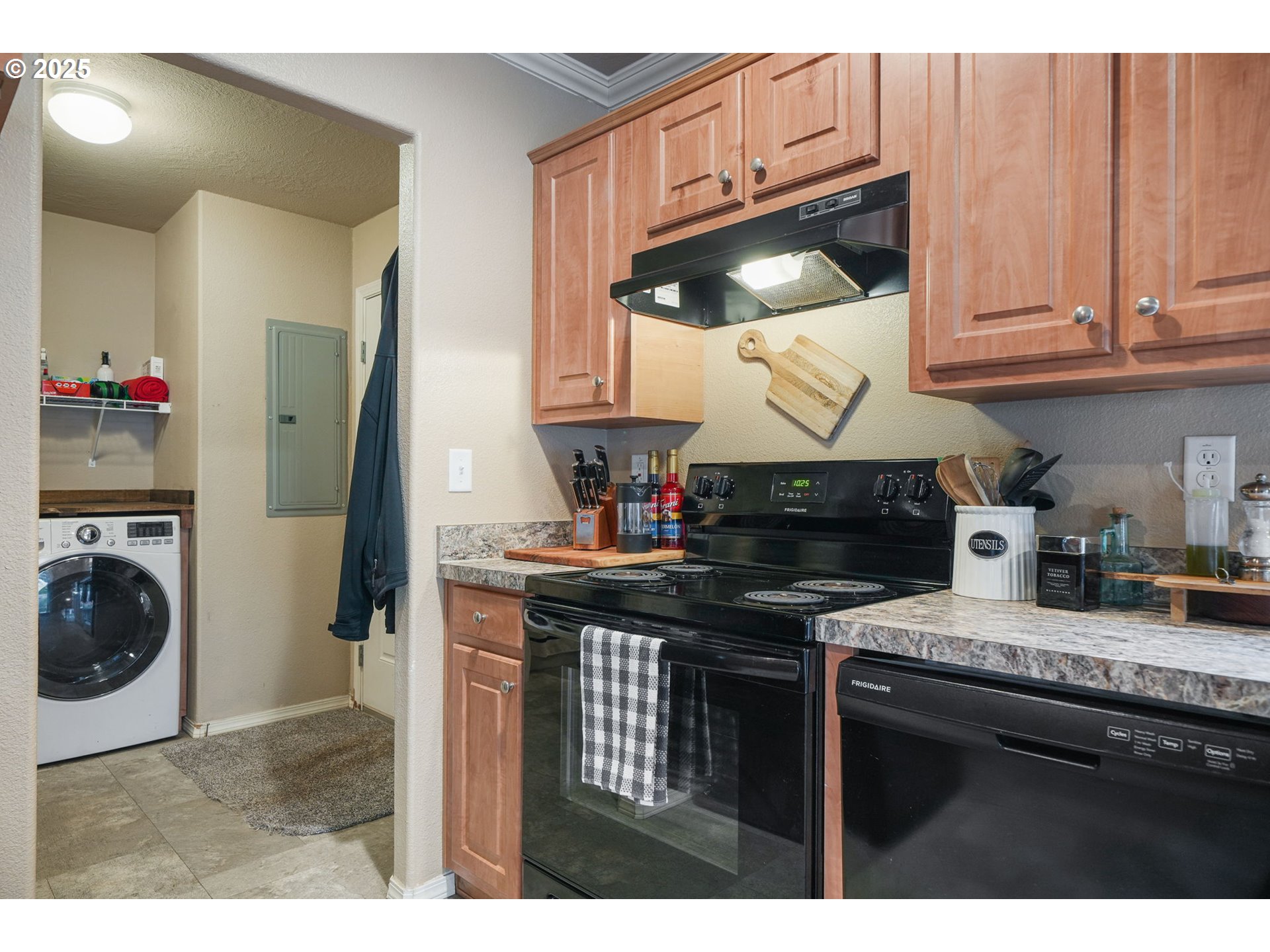 176 West Main Street Alsea, OR 97324 - Photo 7 of 16 a kitchen with stainless steel appliances granite countertop a stove a sink and a microwave