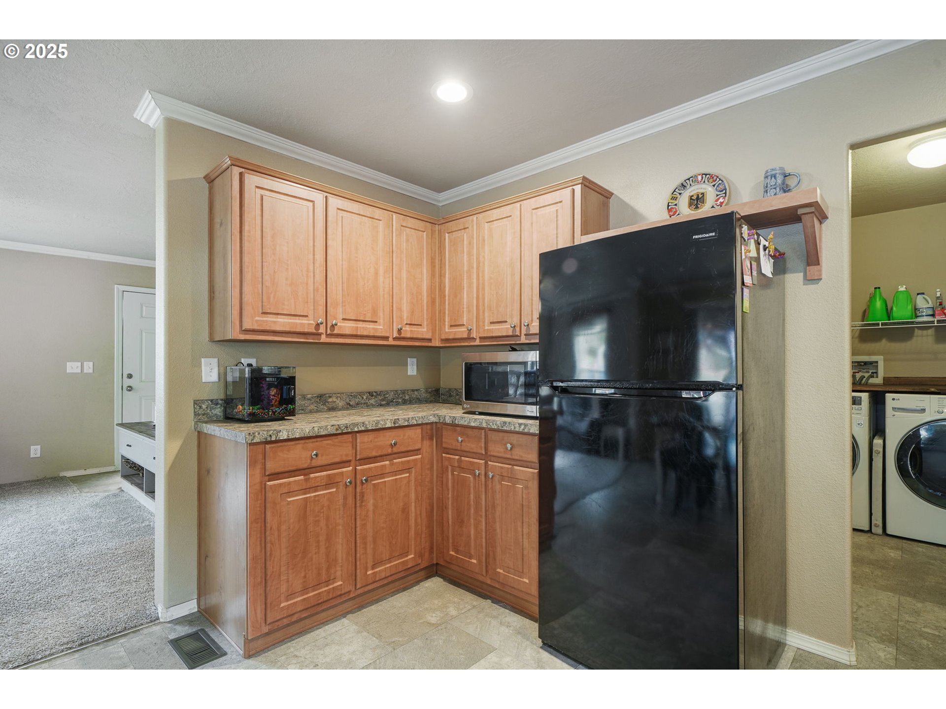 176 West Main Street Alsea, OR 97324 - Photo 8 of 16 a kitchen with a refrigerator and a sink