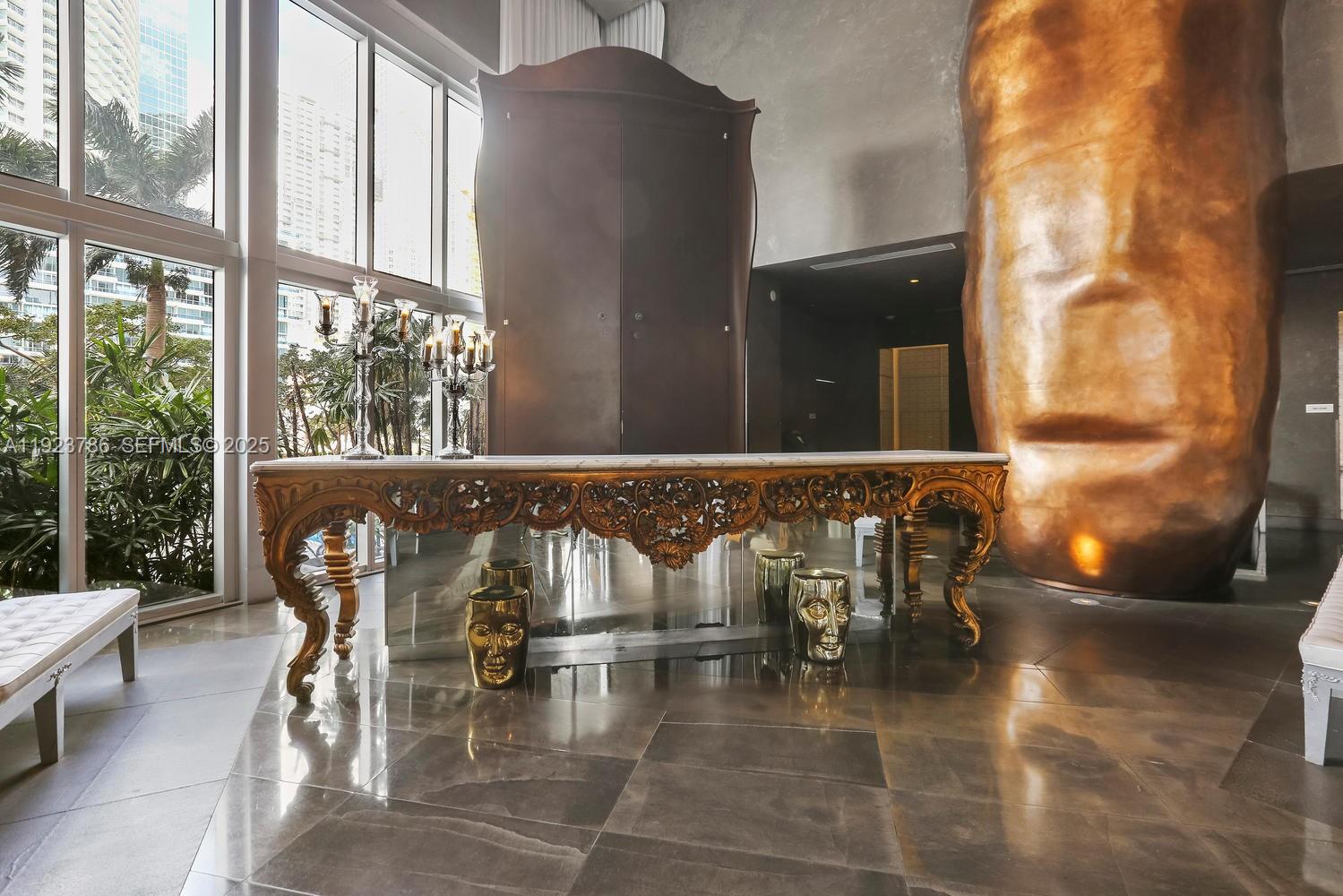 485 Brickell Avenue, Unit 4405 Miami, FL 33131 - Photo 18 of 19 a view of swimming pool with a table and chairs