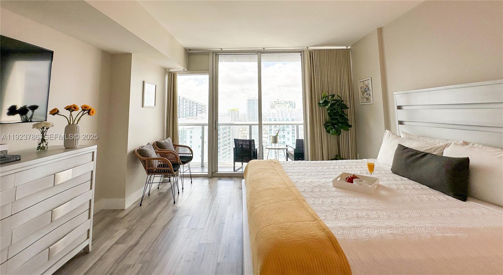 485 Brickell Avenue, Unit 4405 Miami, FL 33131 - Photo 4 of 19 a bedroom with a bed and a large window