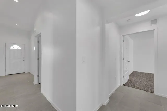 a view of a kitchen with a sink and cabinet