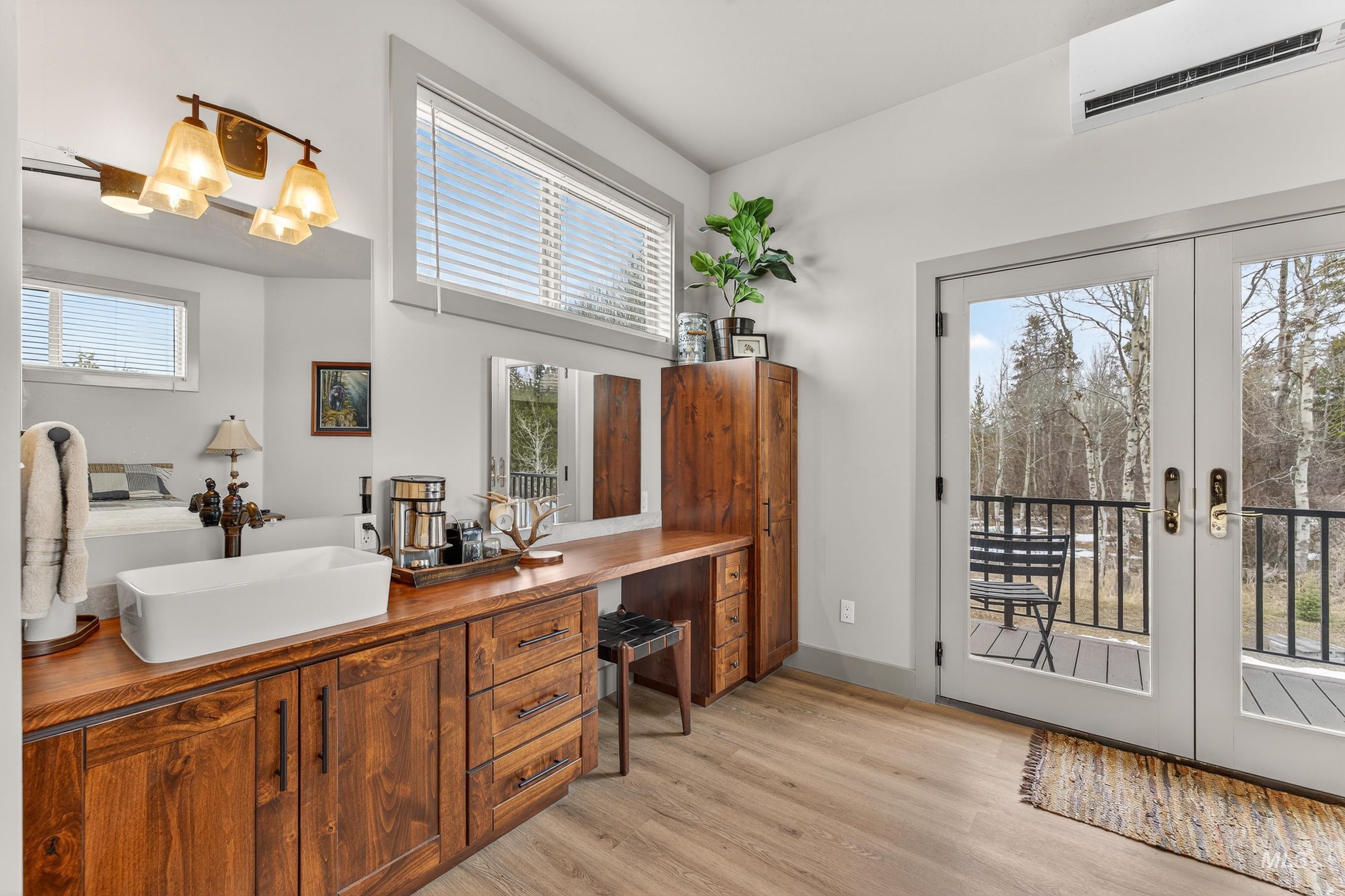 304 Samson Court, Unit 656 McCall, ID 83638 - Photo 17 of 29 Office area with french doors, a wall mounted mini split, and light wood-style floors