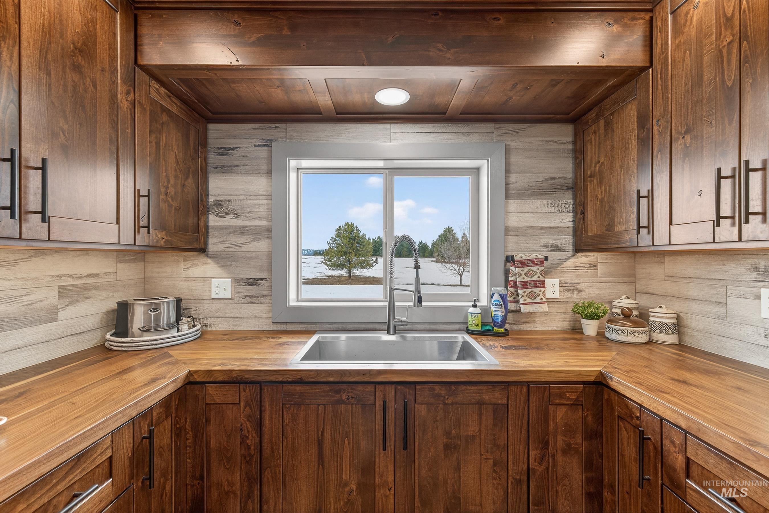304 Samson Court, Unit 656 McCall, ID 83638 - Photo 9 of 29 Kitchen with butcher block countertops and wooden ceiling