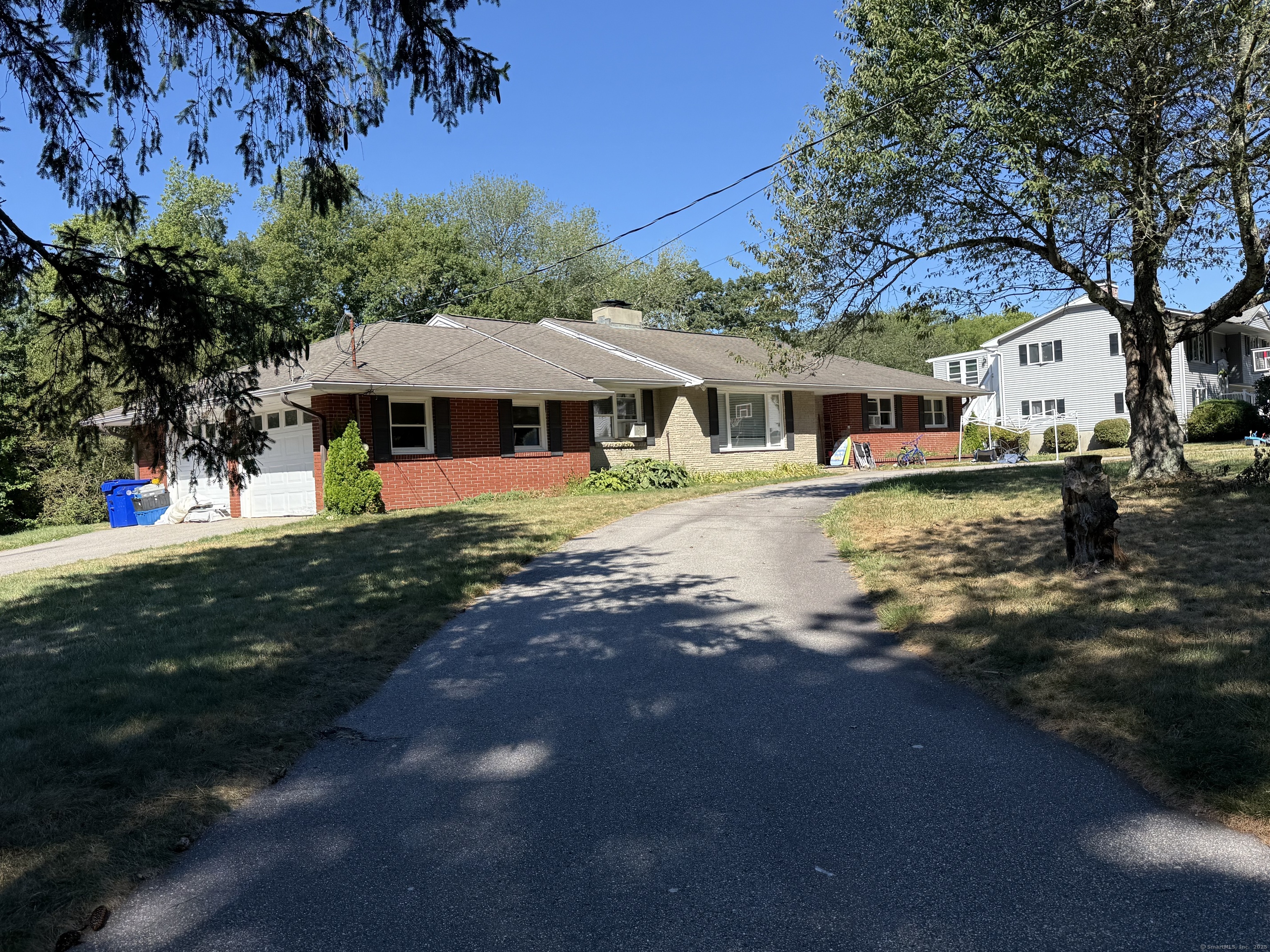 10 Hillcrest Drive Waterford, CT 06385 - Photo 2 of 6 a front view of a house with a yard