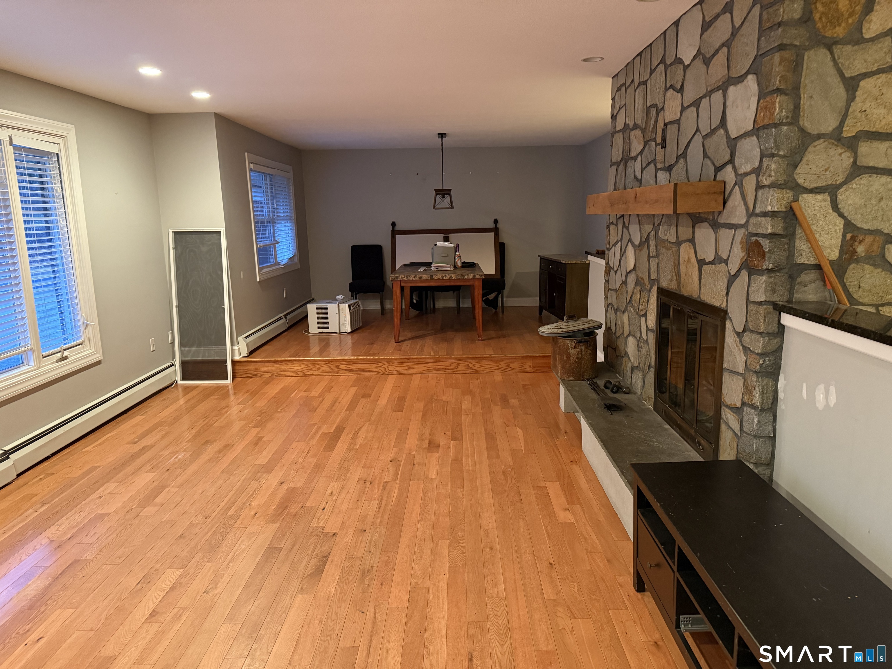 10 Hillcrest Drive Waterford, CT 06385 - Photo 4 of 6 a living room with stainless steel appliances furniture a fireplace and a flat screen tv