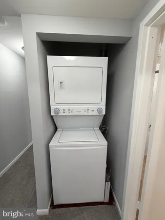 a bathroom with a tub shower vanity and a sink