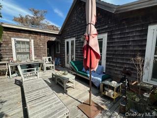 263 E Walk Ocean Beach, NY 11770 - Photo 6 of 6 a building outdoor space with patio furniture
