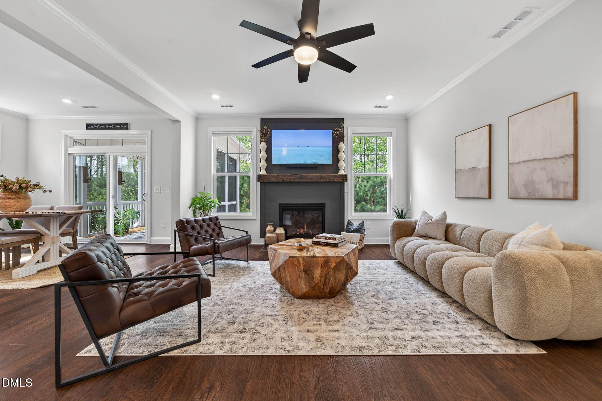 721 Hydrangea Field Court Wake Forest, NC 27587 - Photo 29 of 71 a living room with furniture a fireplace and a flat screen tv