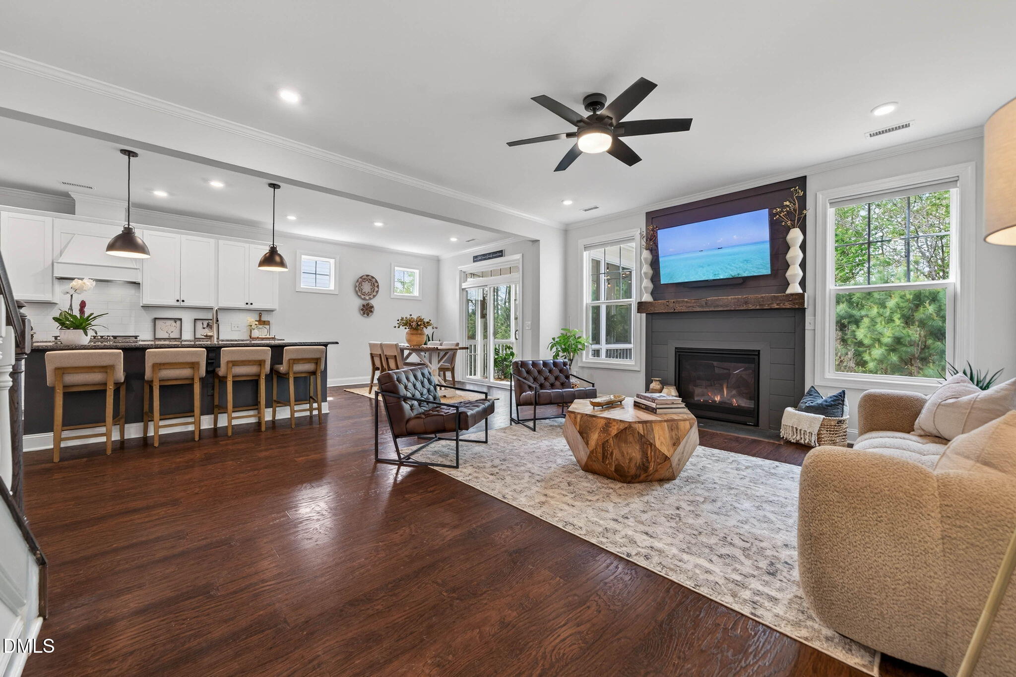 721 Hydrangea Field Court Wake Forest, NC 27587 - Photo 30 of 71 a living room with furniture a fireplace and a flat screen tv