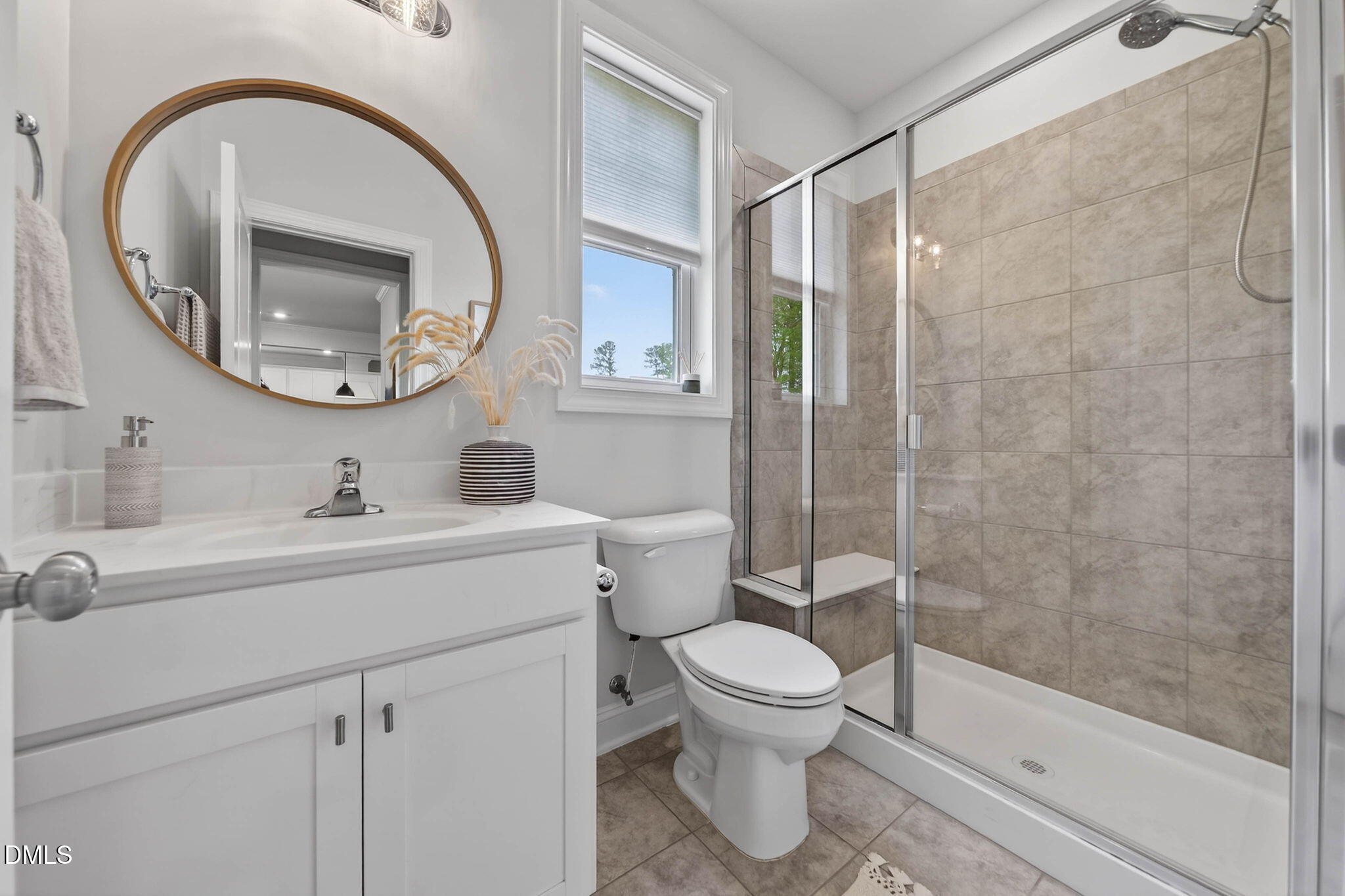 721 Hydrangea Field Court Wake Forest, NC 27587 - Photo 33 of 71 a bathroom with a sink a toilet and a mirror