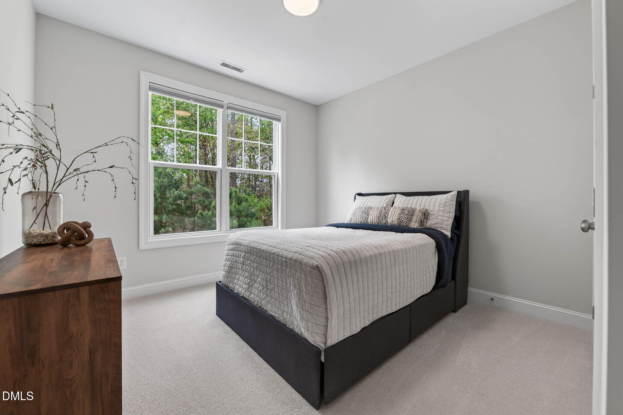 721 Hydrangea Field Court Wake Forest, NC 27587 - Photo 34 of 71 a bed sitting in a bedroom next to a window