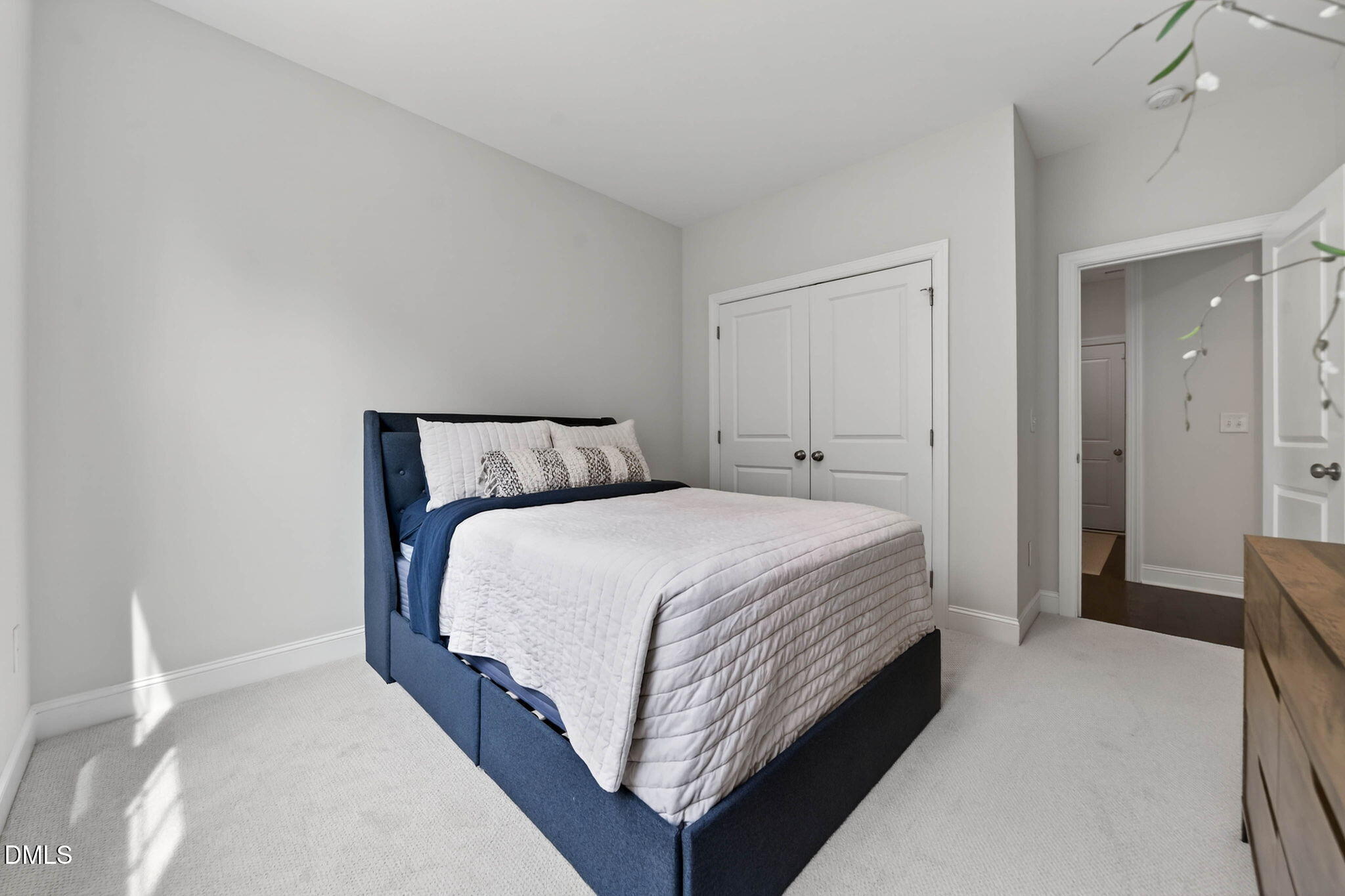 721 Hydrangea Field Court Wake Forest, NC 27587 - Photo 35 of 71 a bedroom with a bed and wooden floor