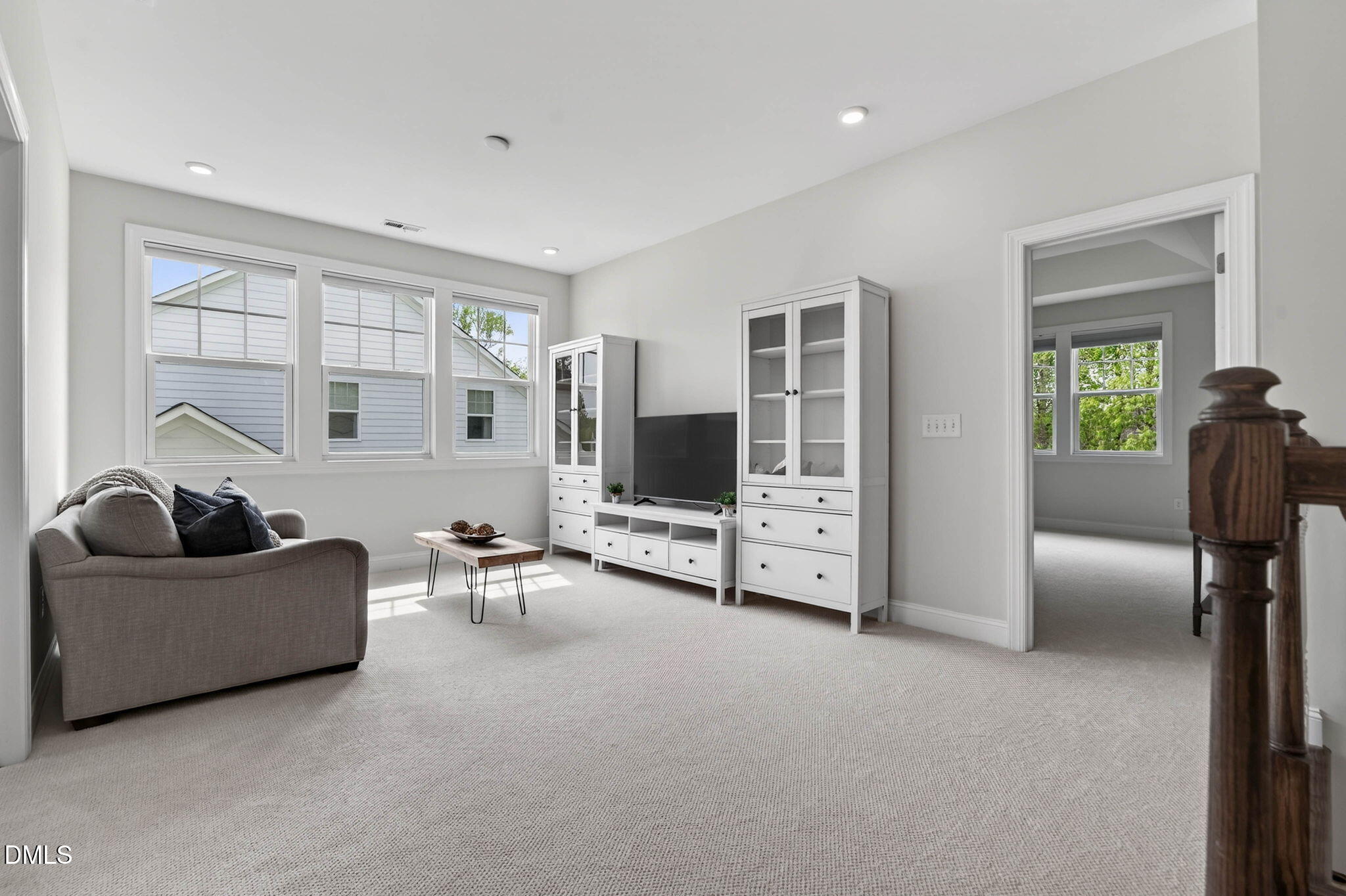 721 Hydrangea Field Court Wake Forest, NC 27587 - Photo 36 of 71 a living room with furniture and a flat screen tv