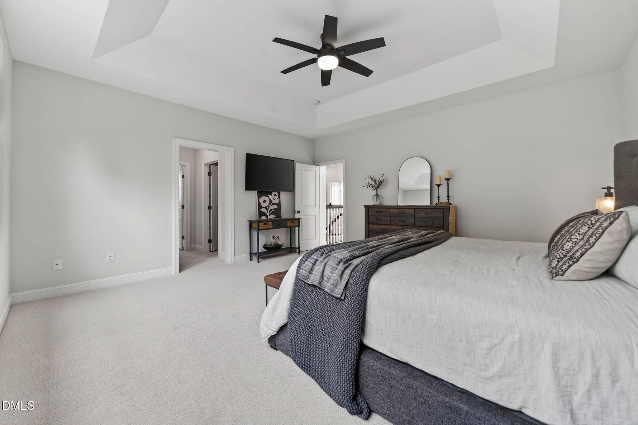 721 Hydrangea Field Court Wake Forest, NC 27587 - Photo 42 of 71 a bedroom with a bed and a ceiling fan