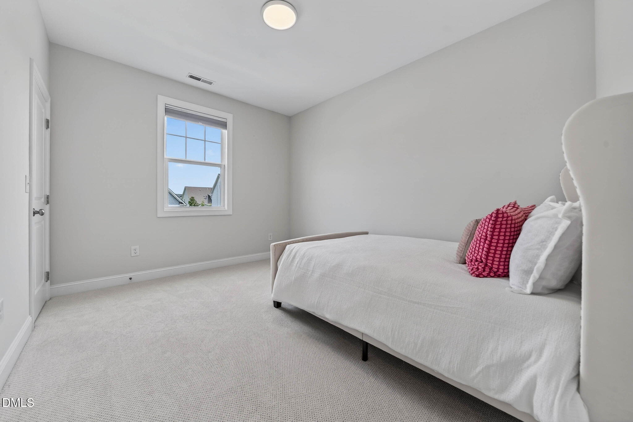 721 Hydrangea Field Court Wake Forest, NC 27587 - Photo 48 of 71 a bedroom with a bed and a window