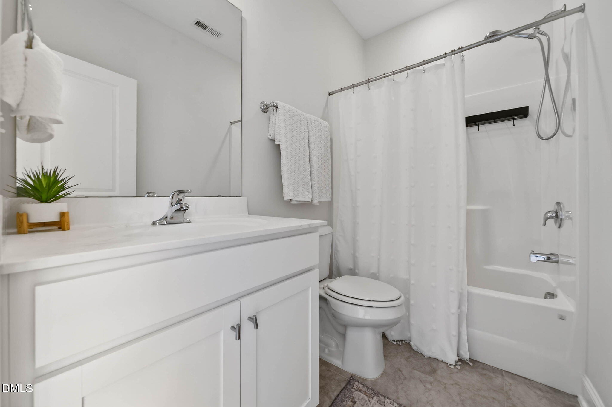 721 Hydrangea Field Court Wake Forest, NC 27587 - Photo 49 of 71 a bathroom with a sink a toilet and shower