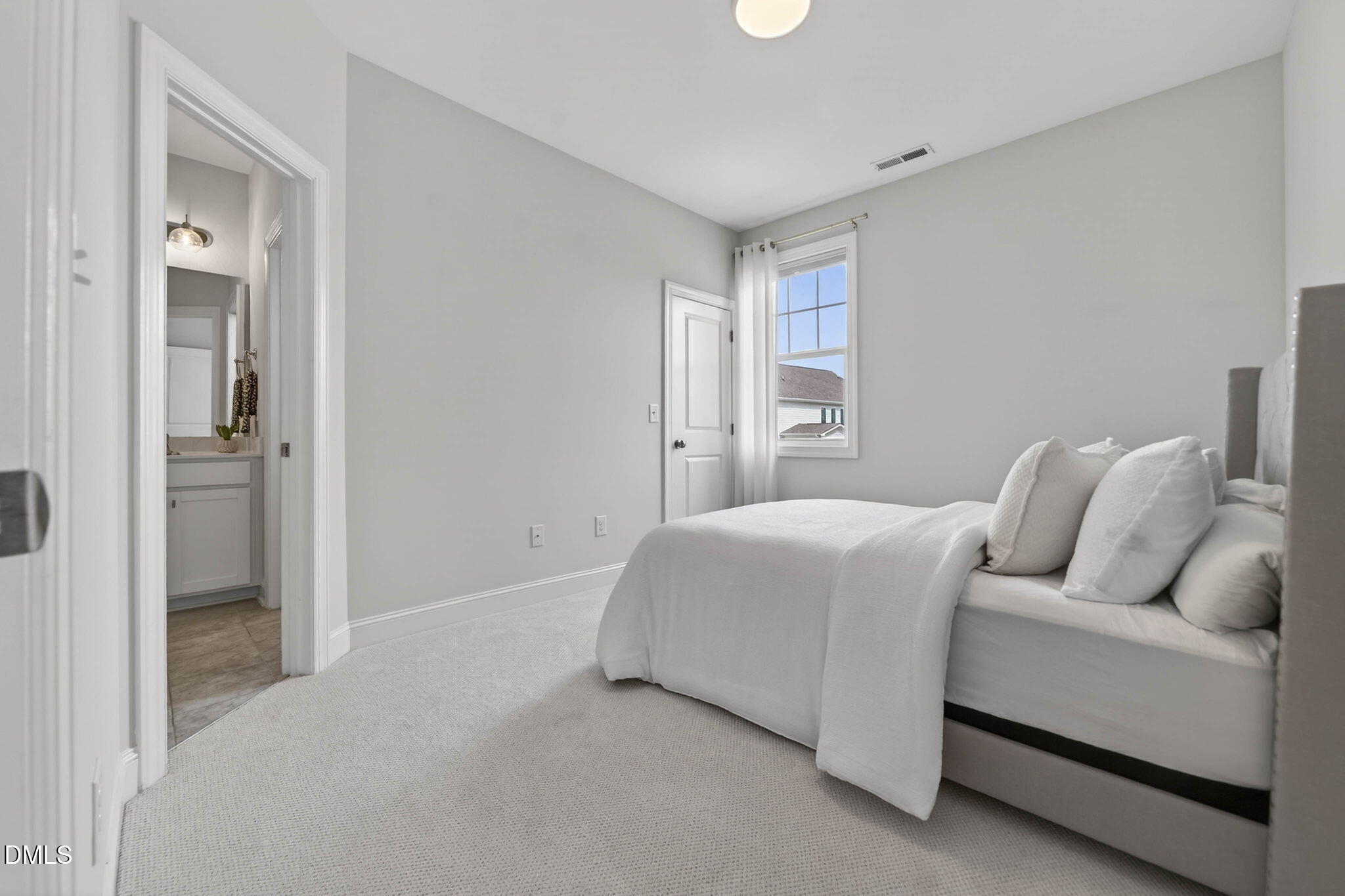 721 Hydrangea Field Court Wake Forest, NC 27587 - Photo 51 of 71 a bed room with a bed and a couch