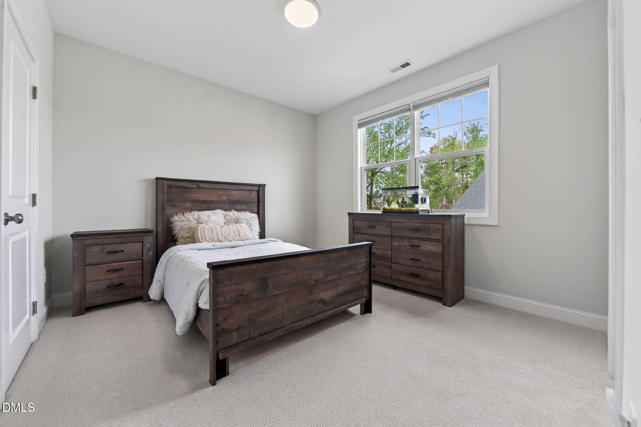 721 Hydrangea Field Court Wake Forest, NC 27587 - Photo 52 of 71 a bedroom with a bed and a window
