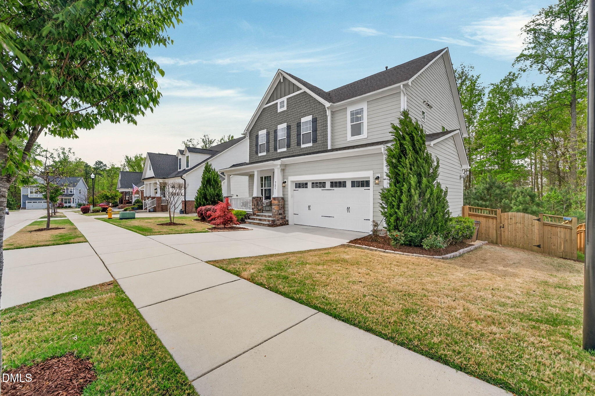 721 Hydrangea Field Court Wake Forest, NC 27587 - Photo 9 of 71 a front view of a house with a yard and trees