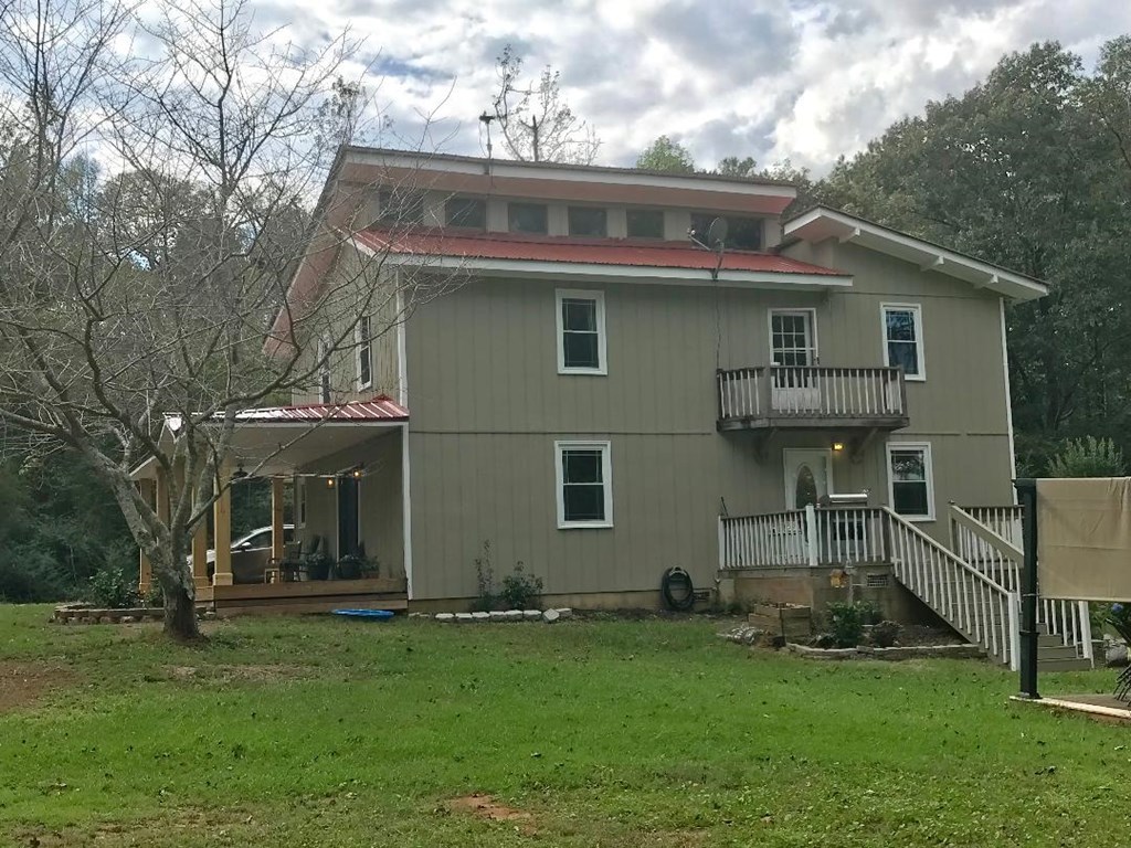 164 Hester Road Forsyth, GA 31029 - Photo 14 of 37 a front view of a house with a garden
