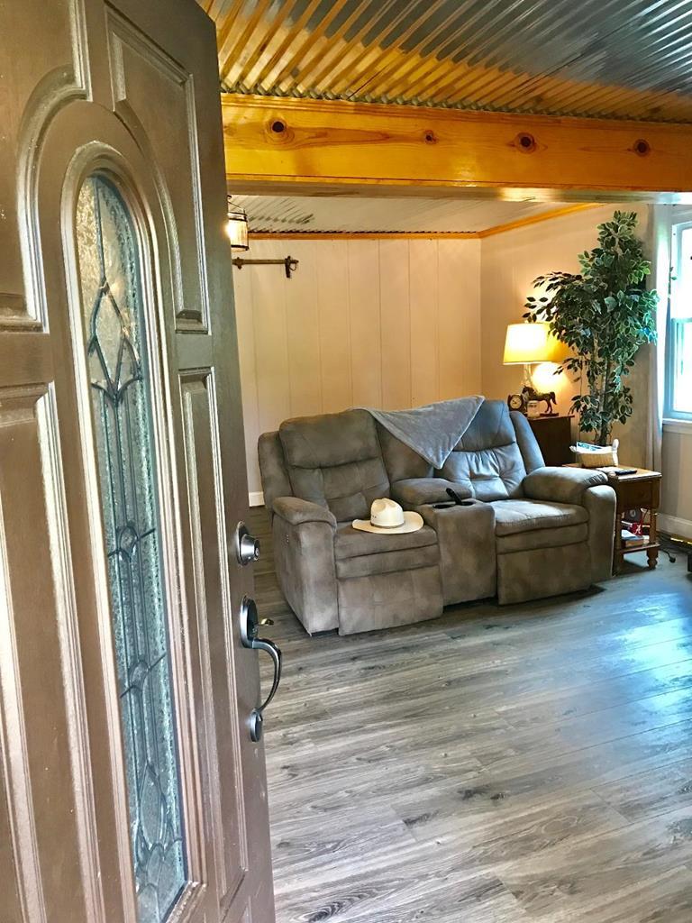 164 Hester Road Forsyth, GA 31029 - Photo 3 of 37 a view of a couches and a table in the balcony