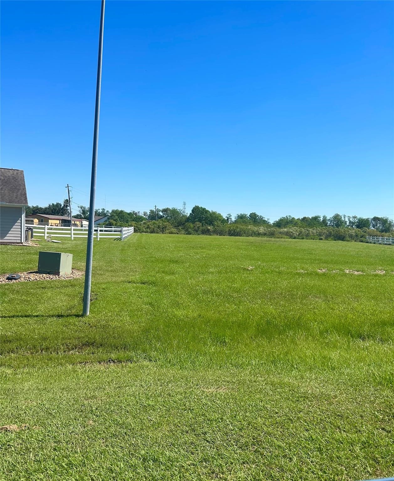 17327 Lake Ridge Circle Rosharon, TX 77583 - Photo 2 of 9 a view of a garden with a lake