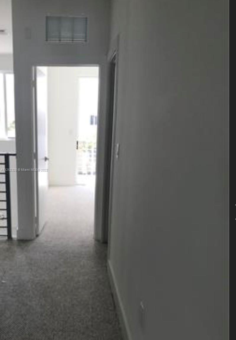 7261 Northwest 103rd Path Doral, FL 33178 - Photo 7 of 10 a view of an empty room