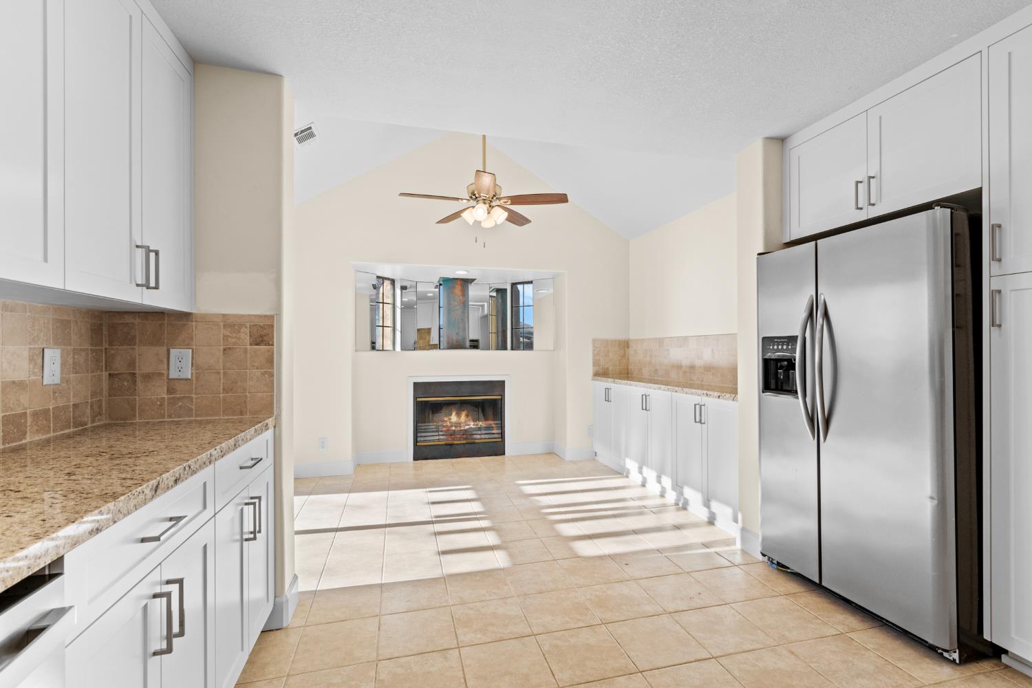 140 Hillside Place Jackson, CA 95642 - Photo 14 of 39 a kitchen with stainless steel appliances granite countertop a refrigerator a stove a sink and dishwasher with white cabinets
